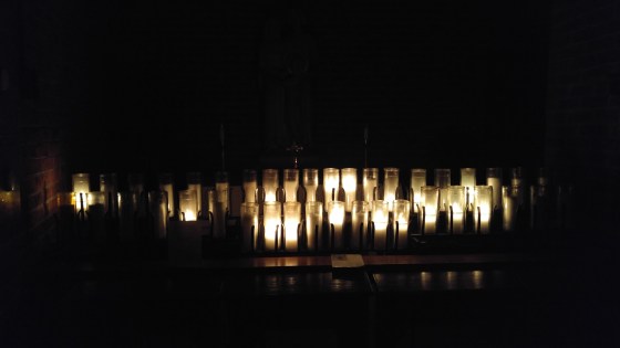 rack of lit votice candles